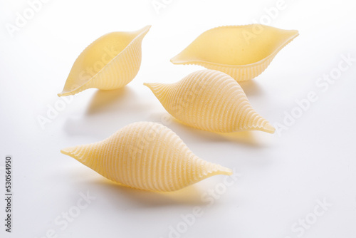 small composition of durum wheat pasta on a white background
