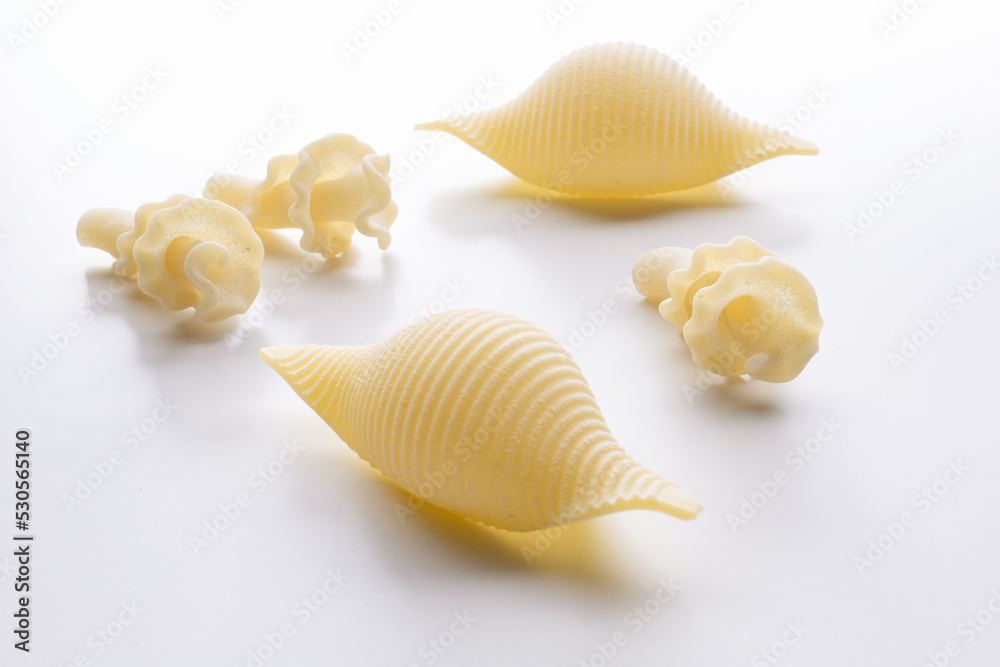 small composition of durum wheat pasta on a white background small composition of durum wheat pasta on a white background