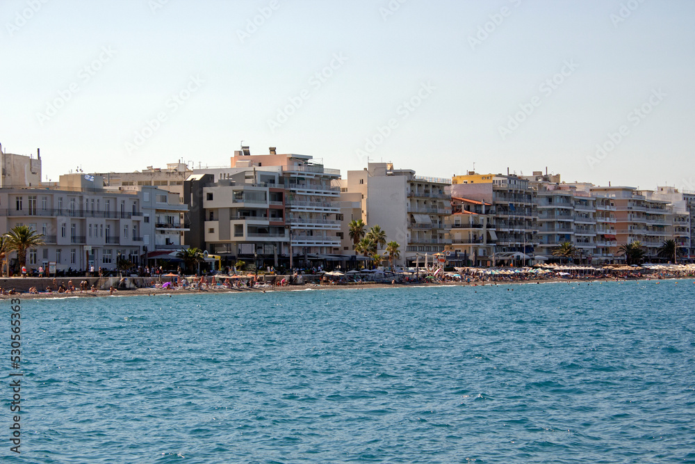 Buildings on the coastline of Loutraki, Greece. Sunny summer day