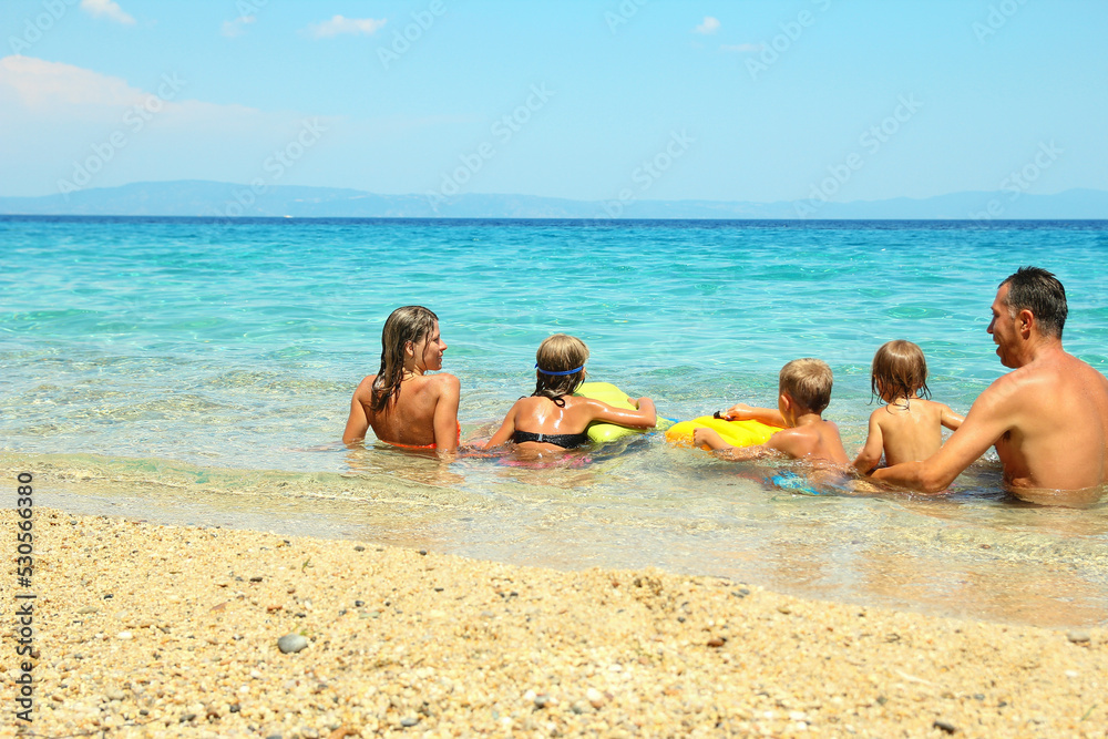 family with children  in the sea concept happiness holidays vacation