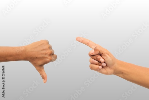 Gesture of hands thumbs down and pointing isolated.