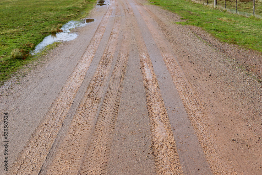 muddy dirt road in the countryside