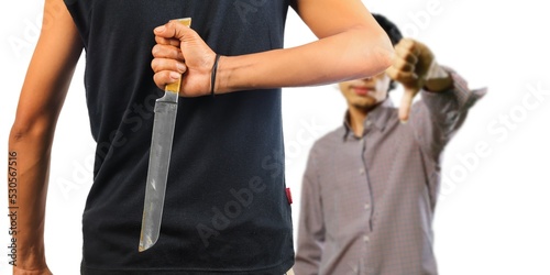 Man hidding a knife in the back.