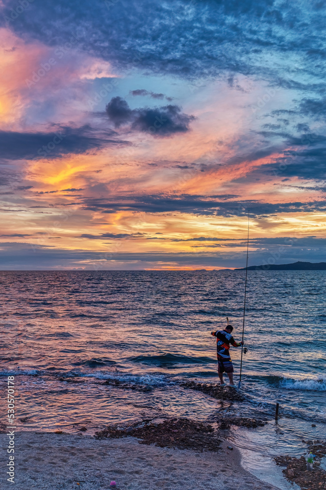 Sunset at a beach near Pattaya, Thailand, during the monsoon (rainy) season, when the skies can produce dramatic colors and cloudscapes Sunset at a beach near Pattaya, Thailand, during the monsoon (rainy) season, when the skies can produce dramatic colors and cloudscapes