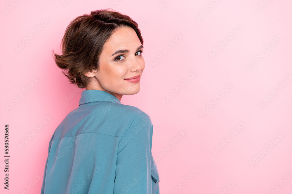 Photo portrait of charming young girl perfect skin turn behind shopping poster wear stylish blue outfit isolated on pink color background Photo portrait of charming young girl perfect skin turn behind shopping poster wear stylish blue outfit isolated on pink color background