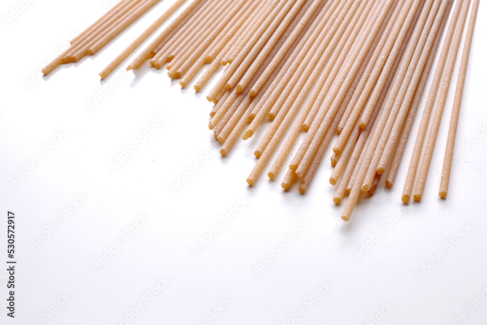 whole wheat durum wheat pasta on wooden background whole wheat durum wheat pasta on wooden background