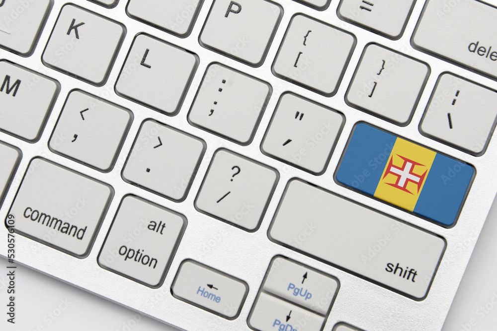 national flag of madeira on the keyboard on a grey background .3d illustration national flag of madeira on the keyboard on a grey background .3d illustration