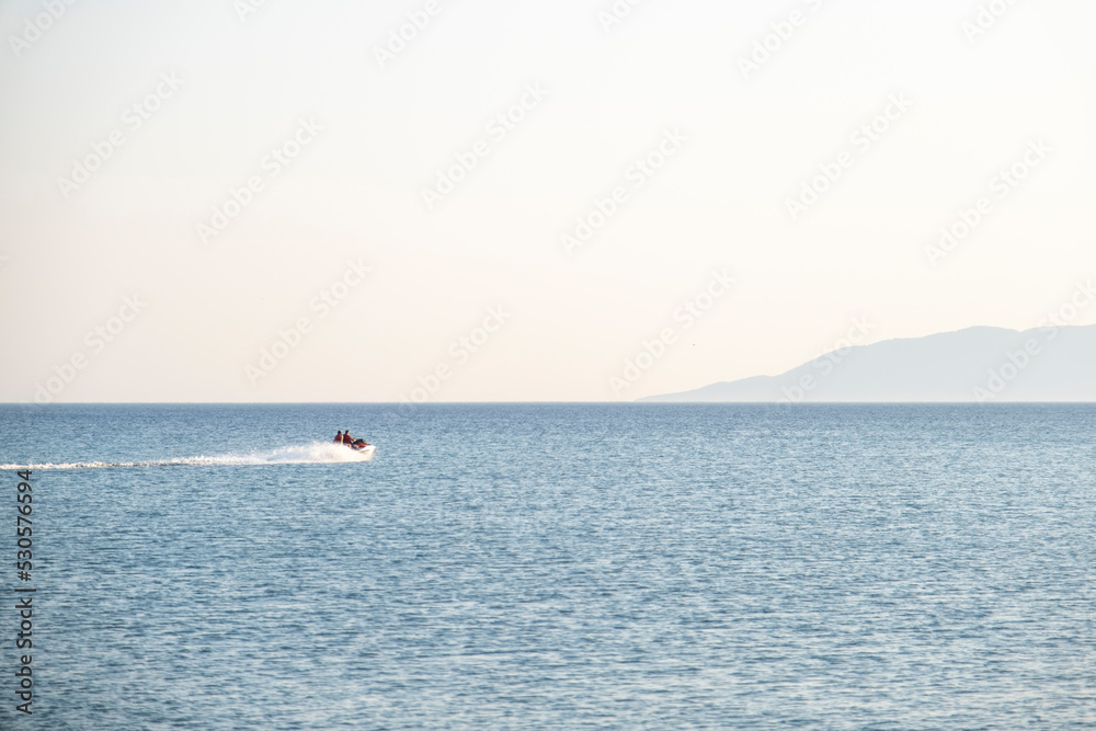 Sea Motor from a distance in calm sea. Selective Focus Vehicle