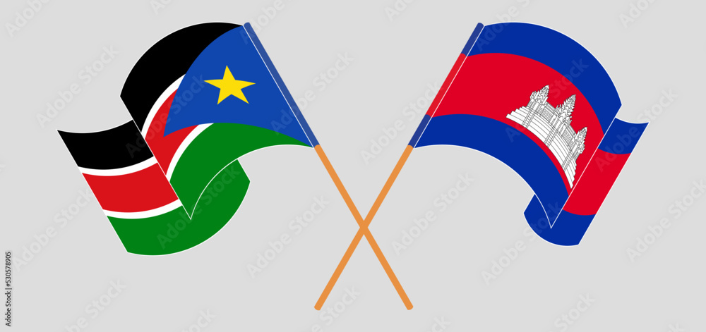 Crossed and waving flags of South Sudan and Cambodia