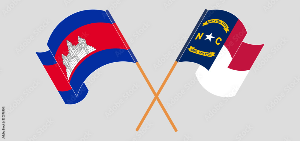 Crossed and waving flags of Cambodia and The State of North Carolina Crossed and waving flags of Cambodia and The State of North Carolina