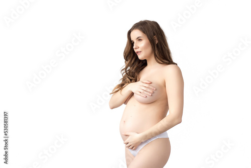 young attractive naked pregnant woman, isolated on white background
