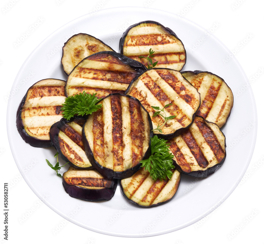 Slices of eggplant roasted on a grill with stripes from a grill isolated Slices of eggplant roasted on a grill with stripes from a grill isolated