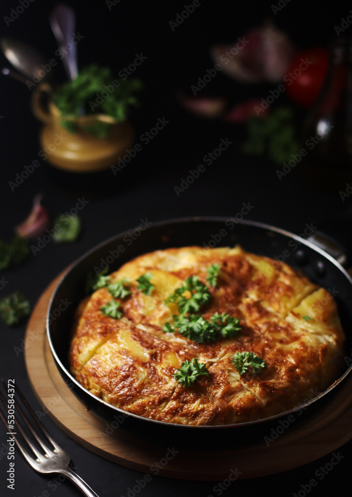 Traditional Spanish dish tortilla on the table Traditional Spanish dish tortilla on the table