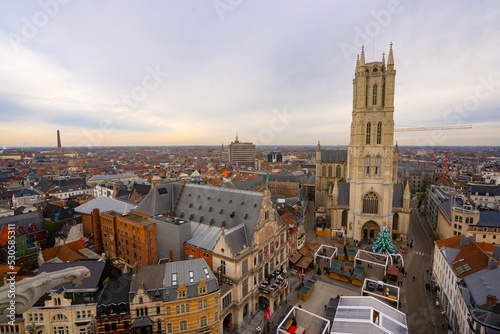 Saint Bavo's Cathedral , and Sint Baafsplein . Beautiful church and square in Ghent during winter cloudy day : Ghent , Belgium : November 30 , 2019 photo