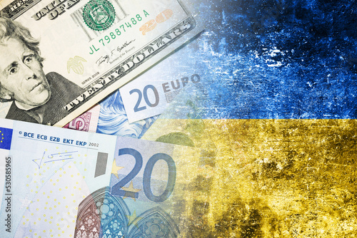 Cost of war background. Euro and dollar currency bill. Yellow and blue ukrainian flag. Flag of Ukraine. Grunge industrial war background. Dirty flag texture. Russian economy background. photo