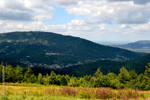 Mountain landscape. Silesian Beskids. One of the Beskids mountain ranges in Outer Western Carpathians in southern Silesian Voivodeship, Poland. Tatras peaks silhouettes in the distance