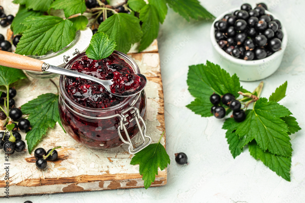 Delicious black currant jam urd, custard or jam and fresh berries, banner, menu, recipe place for text, top view Delicious black currant jam urd, custard or jam and fresh berries, banner, menu, recipe place for text, top view
