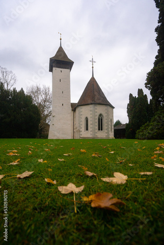 Reformierte Kirche Scherzligen , church near Thun during autumn , winter cloudy day : Thun , Switzerland : December 2 , 2019 photo