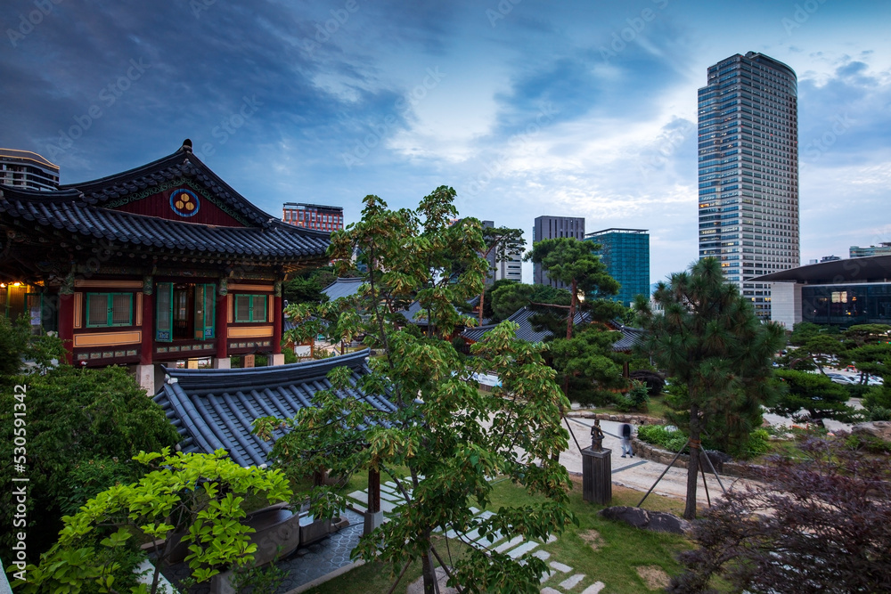 Skyline of Gangnam-gu by the tea house and garden of Bongeunsa Temple, Seoul, South Korea.