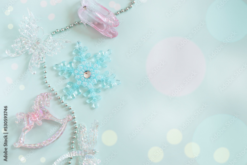 Layout, flat lay in pastel colors, New Year's crystal toys, bokeh.