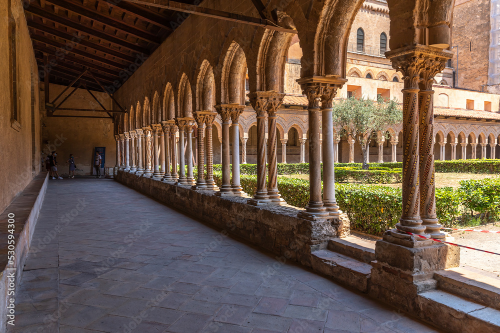 Monreale, Italy - July 8, 2020: Cloister of the cathedral of Monreale (chiostro del duomo di Monreale), Sicily, Italy