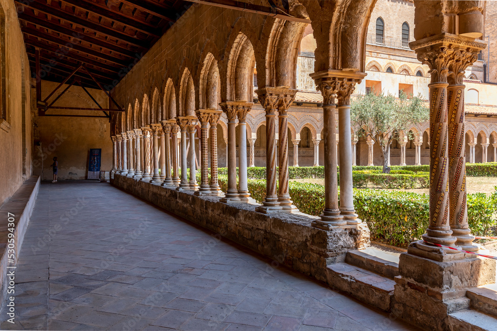 Monreale, Italy - July 8, 2020: Cloister of the cathedral of Monreale (chiostro del duomo di Monreale), Sicily, Italy
