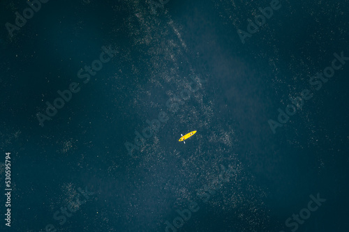 high angle view of yellow kayak floating in the lake
