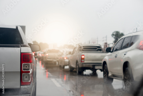 Abstract of rear pickup car. Rear side view of car in rainy time and traffic jam. Traffic congestion with many queues due to the wet asphalt road surface. 