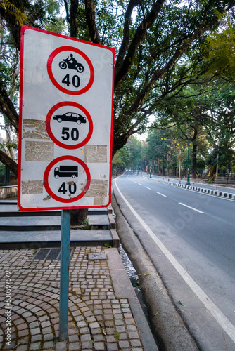 Maximum Speed Limit sign board for different kinds of vehicle on National Highway Rajpur road. Dehradun city of Uttarakhand, India. photo