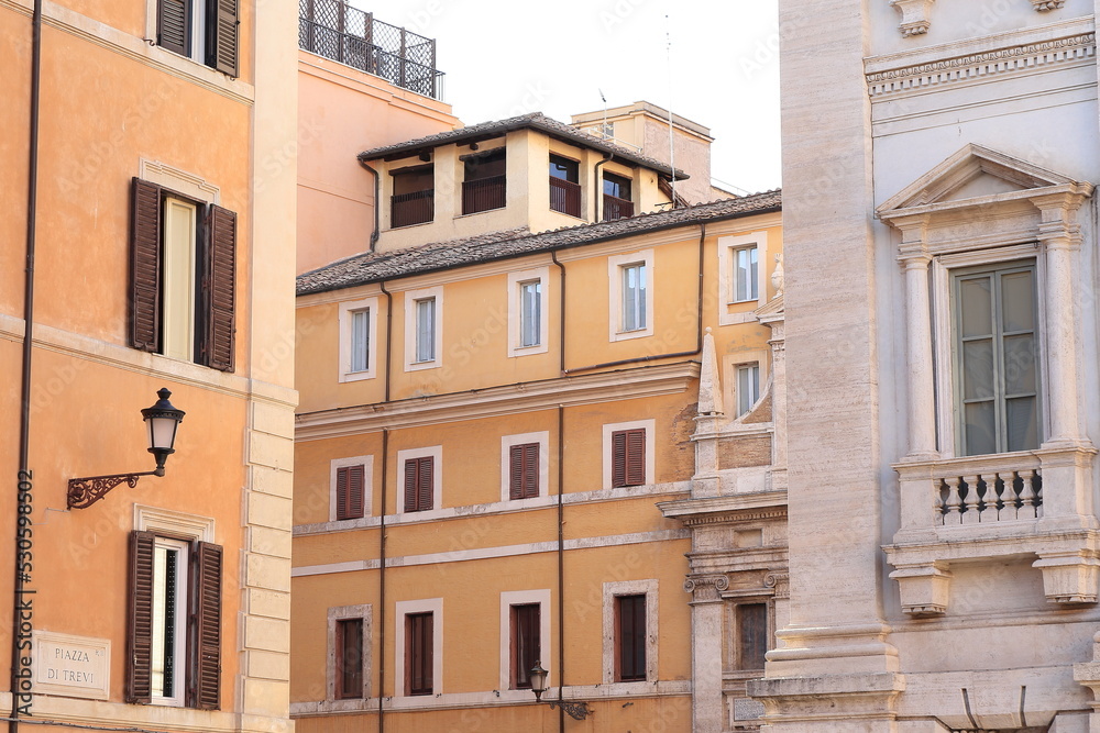 Trevi Square Street View with Building Facades and Lantern in Rome, Italy