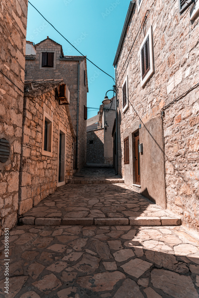narrow street in old town in Primosten, Croatia
