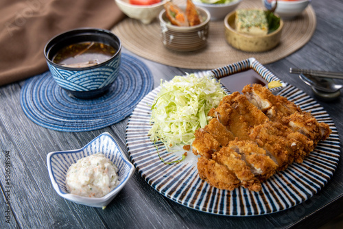 Pork cutlet and various Asian-style side dishes