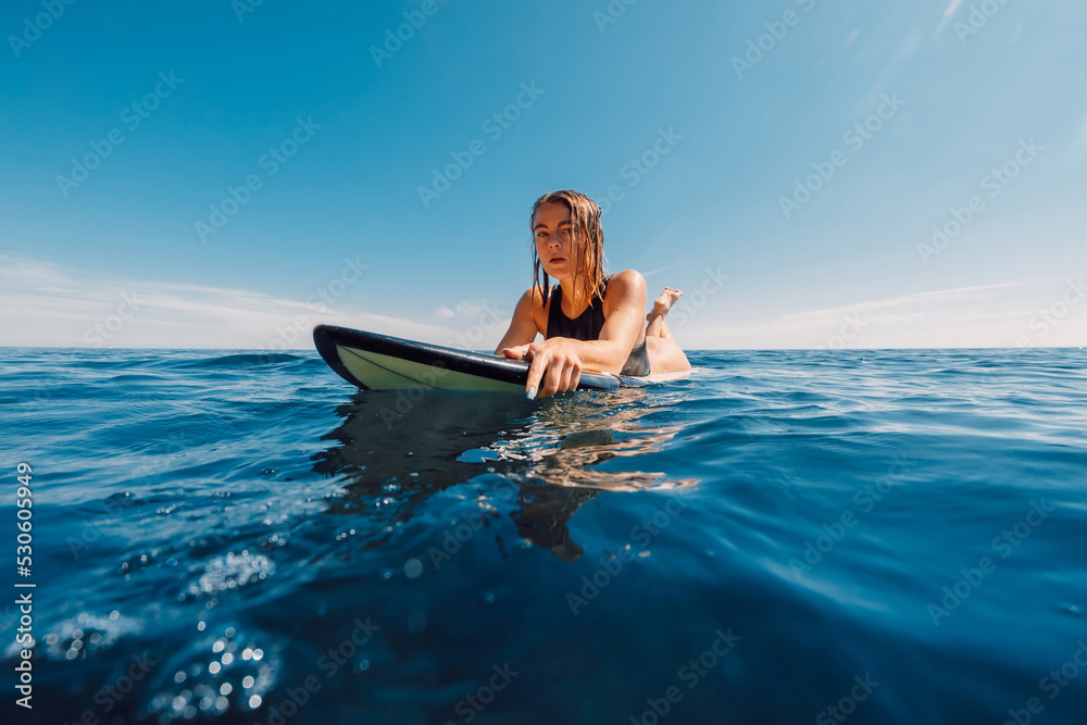 Photo & Art Print Portrait of blonde surf girl on surfboard in 