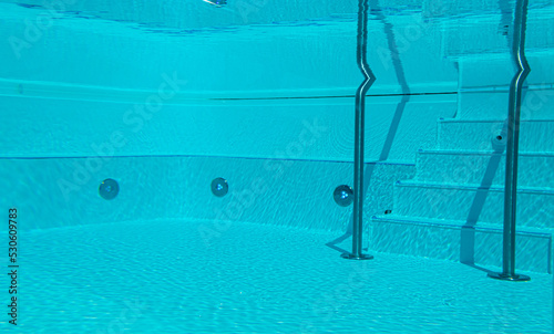 Underwater view of swimming pool with stairs. © Nancy Pauwels