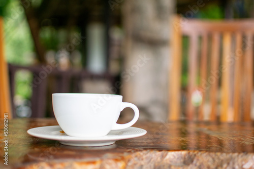 Coffee Cup on Table Against Landscape Scenery Mountain Hill Background