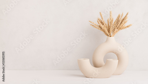 Wheat ears in a stylish modern vase, Scandinavian interior decoration concept, banner, copy space photo
