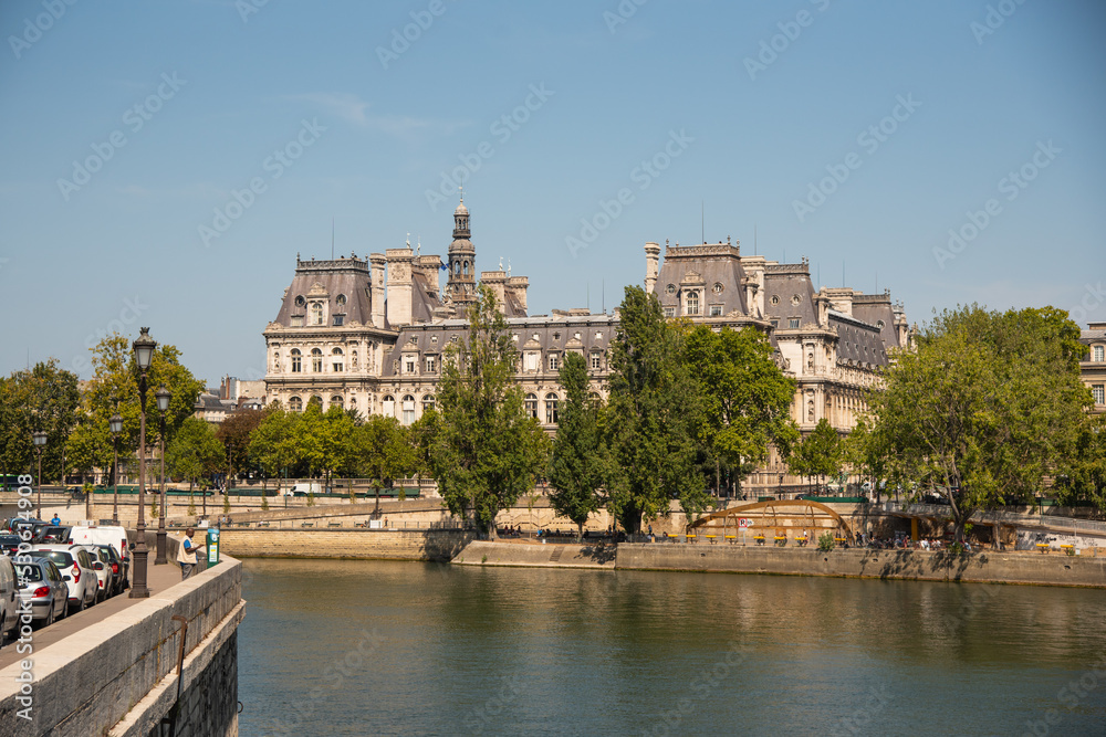 Paris, France. August 2022. The picturesque embankments of the Seine in Paris, France. Buildings and trees.