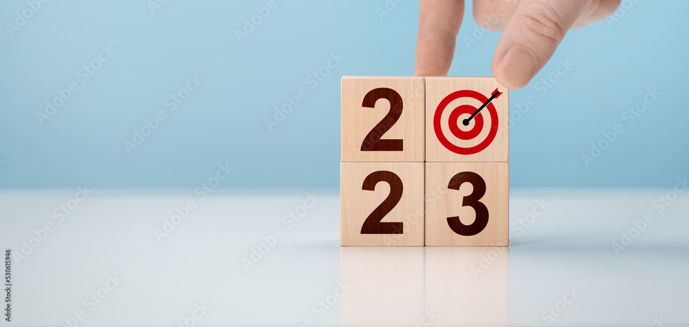 2023 time for new start. Goals, plan, strategy, business, idea, action concept. 2023. Happy New Year. 2023 Goal, Plan, Action alphabet letter on wooden cubes.