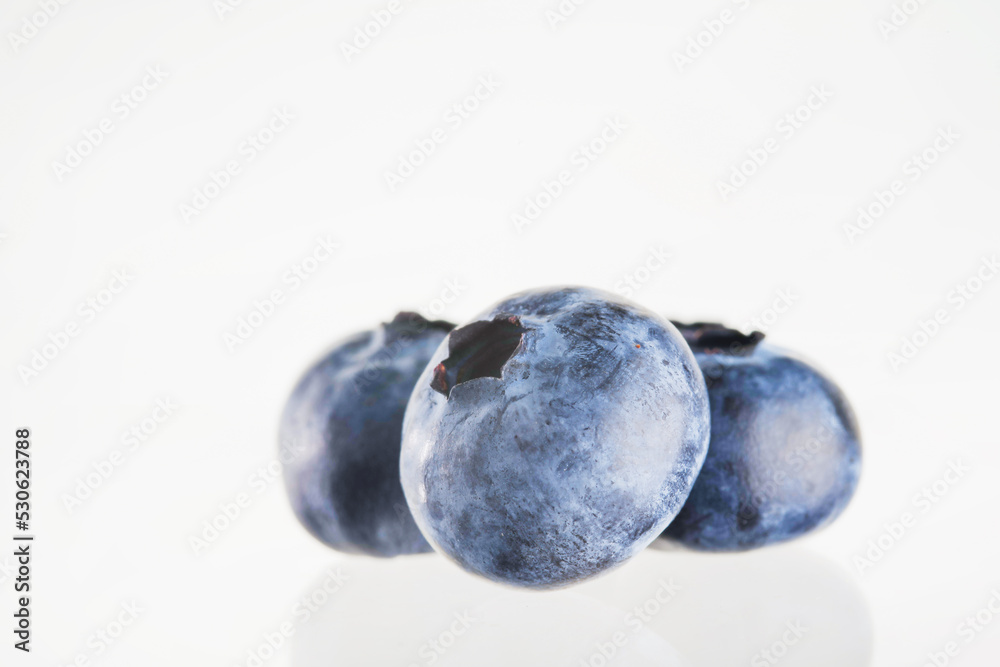 Blueberries on a white background. Close-up. Minimalism. There are no people in the photo. Tasty healthy product, juices, jams, stuffing for confectionery. Blueberries on a white background. Close-up. Minimalism. There are no people in the photo. Tasty healthy product, juices, jams, stuffing for confectionery.