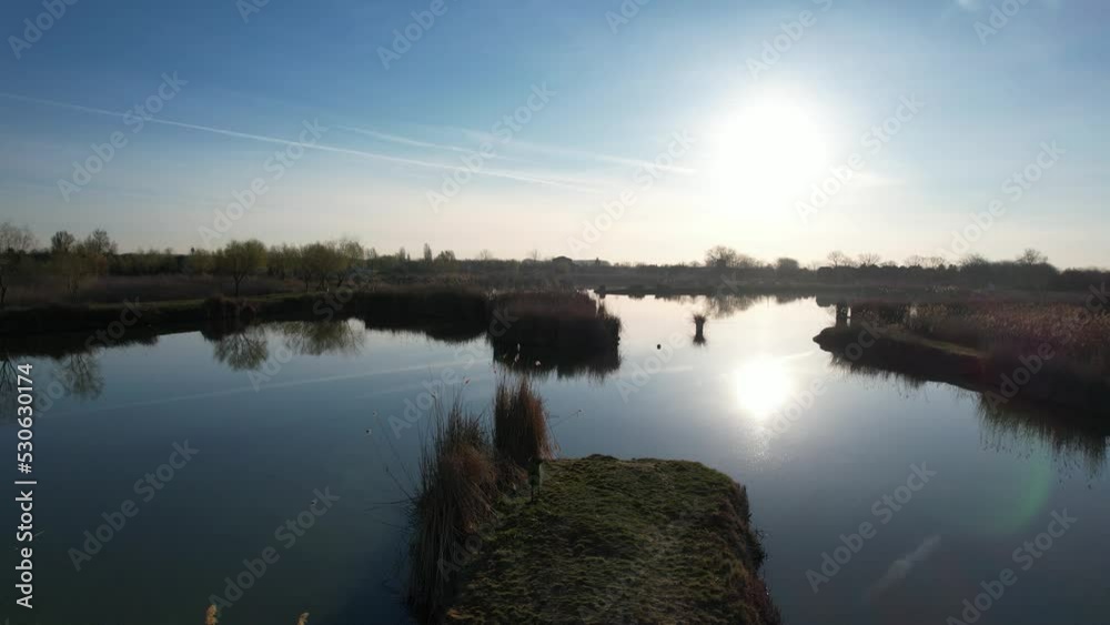 Rising up drone shot of a fishing lake Rising up drone shot of a fishing lake