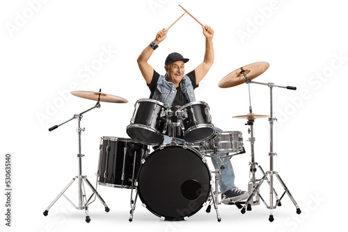 Cheerful mature drummer with drumsticks up