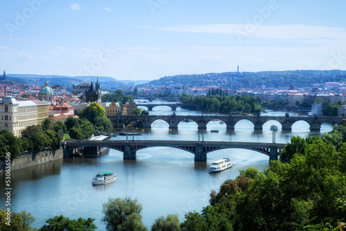 View of the bridges on the Vlatva River in the Czech city of Prague from the Summer Gardens.