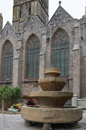 Antique stone fountain, Vasque de Keilinsky, in front of the Cathedral. Saint Pol de Leon, France photo