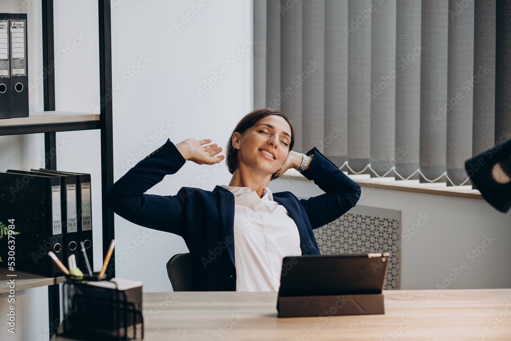 Business woman working on tablet at the office Business woman working on tablet at the office