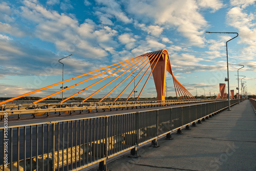 cable-stayed bridge in Riga, in the photo south bridge in the evening against the background of blue sky and clouds photo