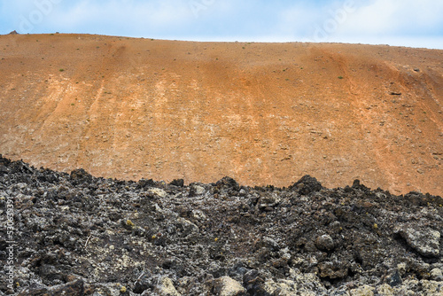 Quadro em tela Volcanoes, black lava and islets of Lanzarote seen from Caldera Blanca