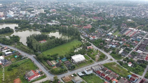 Aerial view of urban traffic lane in Road roundabout with car lots Wongwian Yai in Yala,Thailand.street large beautiful downtown plan, Top view of cityscape and transport highway