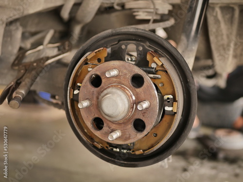 wheel of a car. rear drum brake. drum brake. Maintenance and replacement of drum brake pistons.