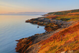 View from Point Lynas looking toward Snowdonia at first light. Anglesey, North Wales, UK.