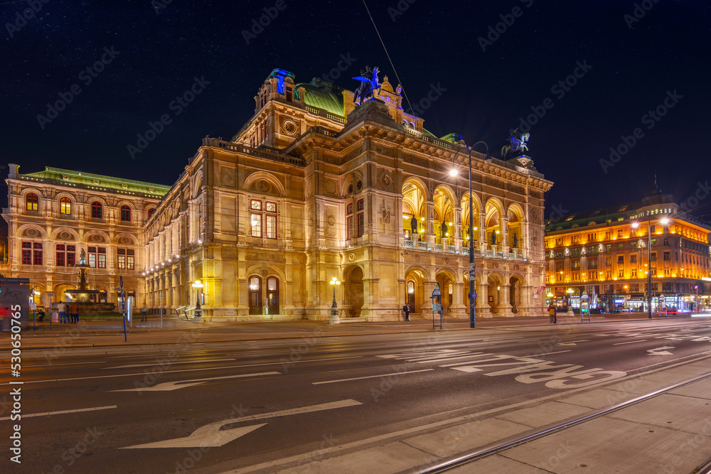 vienna, austria - oct 17, 2019: facade of famous opera house at night. popular travel destination